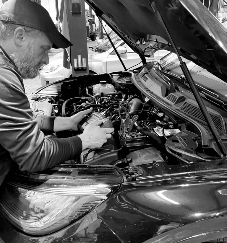 Mason Automotive mechanic inspecting a vehicle