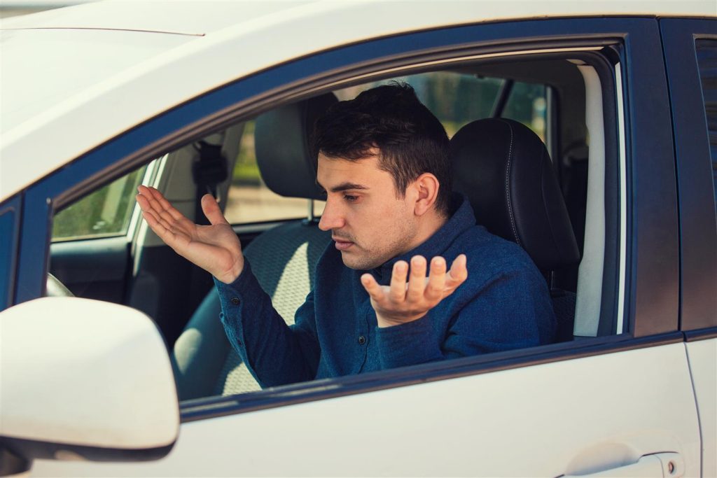 IU student upset in a shaking car because of poor tire alignment