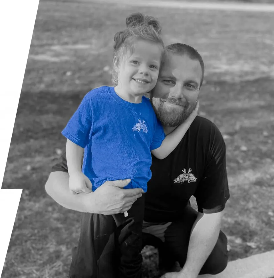 Jarred Mason, owner of Mason Automotive, with his daughter